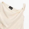 Asymmetrisk topp med knutedetaljer Asymmetrisk topp med knutedetaljer