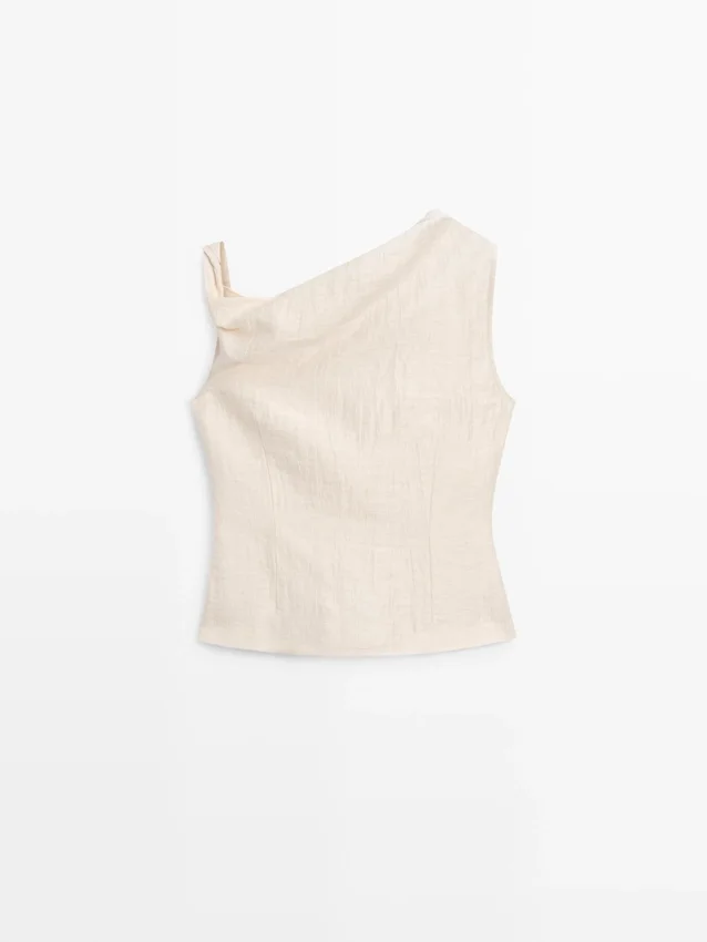 Asymmetrisk topp med knutedetaljer Asymmetrisk topp med knutedetaljer