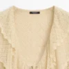 Cardigan i linblanding med volangdetaljer Cardigan i linblanding med volangdetaljer