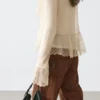 Cardigan i linblanding med volangdetaljer Cardigan i linblanding med volangdetaljer