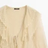 Cardigan i linblanding med volangdetaljer Cardigan i linblanding med volangdetaljer