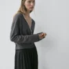 Krysset strikket cardigan med blonder Krysset strikket cardigan med blonder