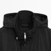 Parka med hette og stoffdetaljer Parka med hette og stoffdetaljer