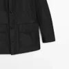 Parka med hette og stoffdetaljer Parka med hette og stoffdetaljer