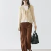 Cardigan i linblanding med volangdetaljer Cardigan i linblanding med volangdetaljer