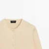 Strikkecardigan i ull med rund hals Strikkecardigan i ull med rund hals
