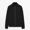 Strikket cardigan i bomullsblanding med raglanermer Strikket cardigan i bomullsblanding med raglanermer