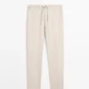 Total Look-linnebukser med detalj i livet Total Look-linnebukser med detalj i livet